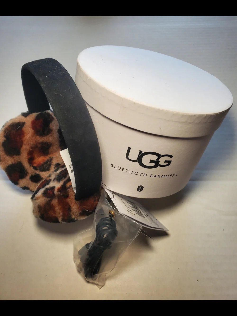 UGG Sheepskin Leopard Print Adjustable Wireless Bluetooth Earmuffs. NIB $75.00
